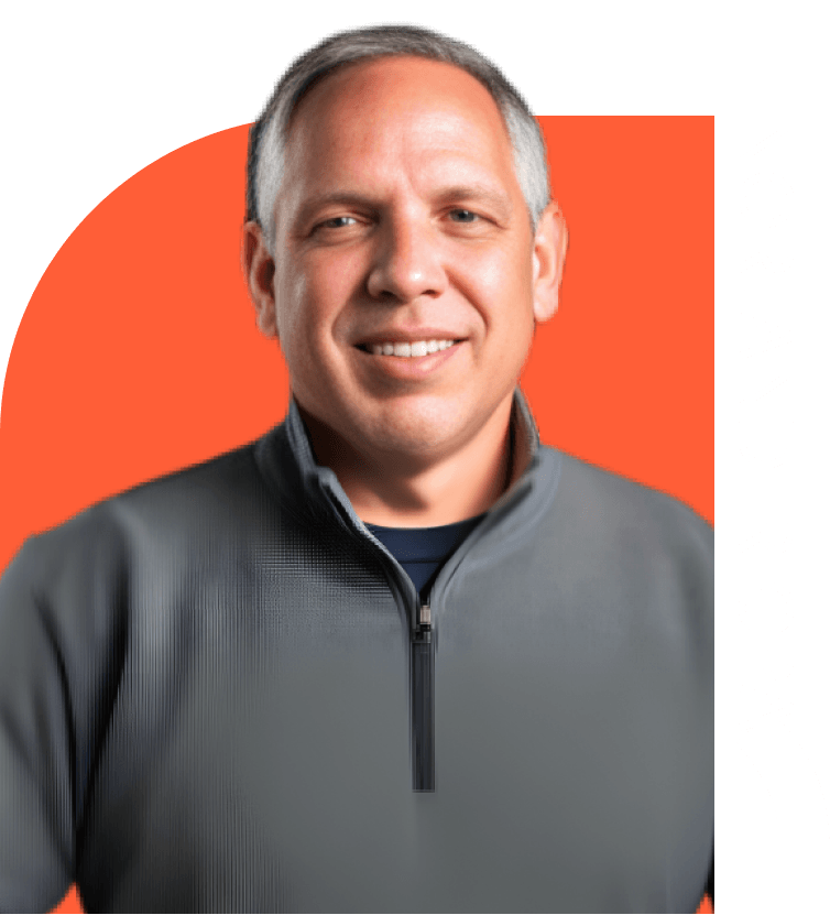 Robert Nordlander in a gray t-shirt with orange background smiling